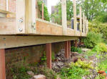 Sturdy post supports for raised deck frame