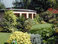 This garden design was centered about planting and horticultural features - much to do with screening the large garden building