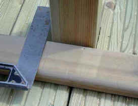 Top rail of balustrade being marked ready for accurate cutting to size